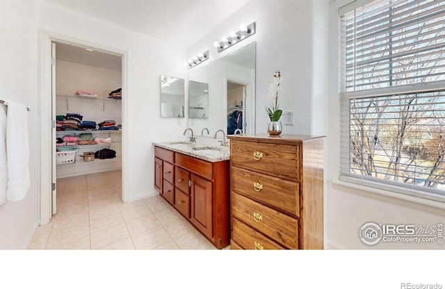 7145 Brittany Dr, Fort Collins, CO 80525 - full bath with a walk in closet, vanity, and tile patterned floors