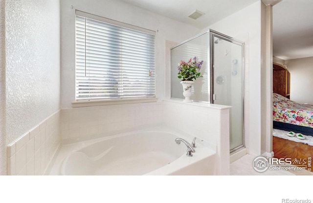 7145 Brittany Dr, Fort Collins, CO 80525 - ensuite bathroom with a garden tub and a shower stall