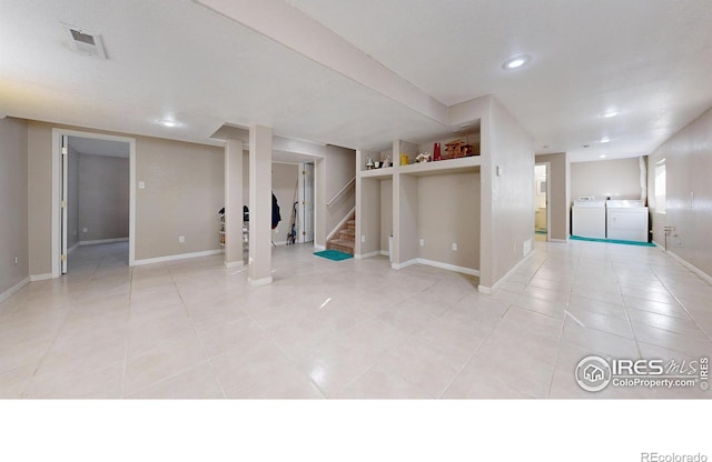 7145 Brittany Dr, Fort Collins, CO 80525 - finished basement featuring separate washer and dryer, light tile patterned flooring, stairway, baseboards, and recessed lighting