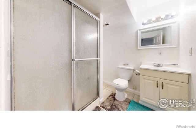 7145 Brittany Dr, Fort Collins, CO 80525 - bathroom with a shower stall, tile patterned flooring, toilet, and vanity