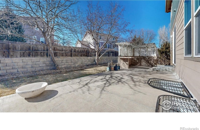 7145 Brittany Dr, Fort Collins, CO 80525 - view of patio / terrace with a fenced backyard