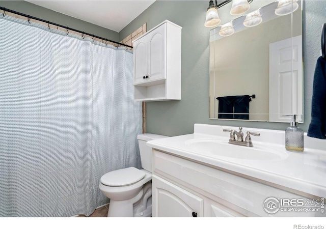 full bathroom with vanity and toilet