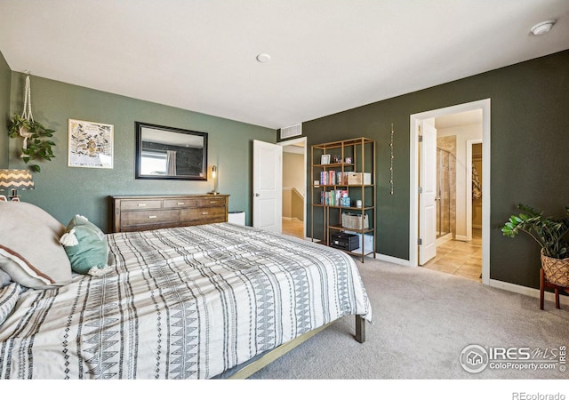 bedroom with carpet floors, baseboards, and visible vents