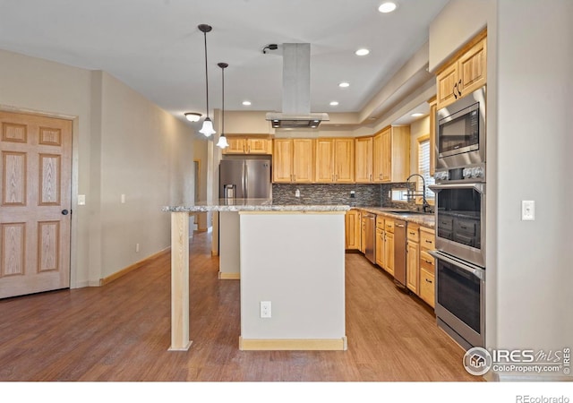 kitchen with backsplash, light brown cabinets, a sink, island range hood, and light wood-type flooring