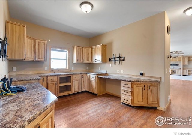 kitchen featuring light wood-style flooring and light brown cabinetry