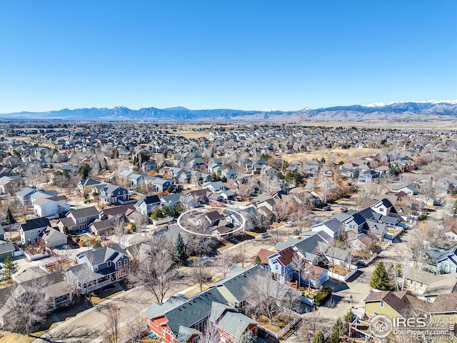 birds eye view of property featuring a mountain view and a residential view