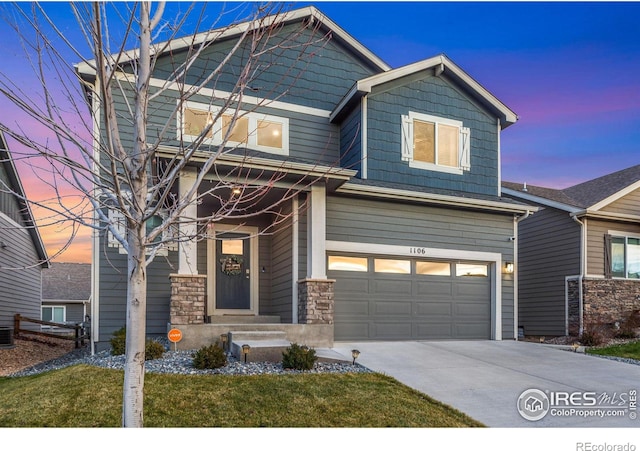 craftsman-style home with driveway, stone siding, an attached garage, and central air condition unit