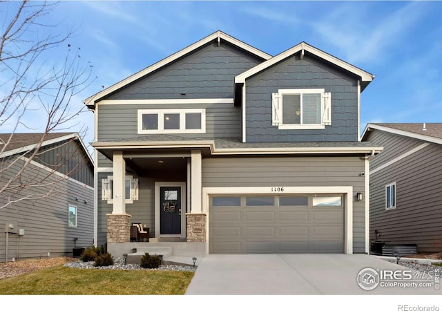 craftsman-style house featuring a garage, concrete driveway, and central AC unit