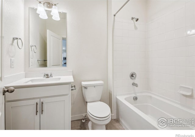 full bathroom featuring  shower combination, tile patterned flooring, vanity, and toilet