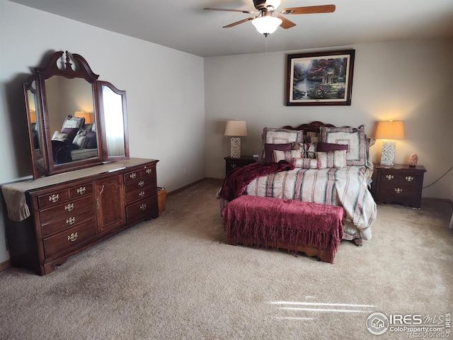 carpeted bedroom with a ceiling fan