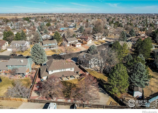 birds eye view of property with a residential view