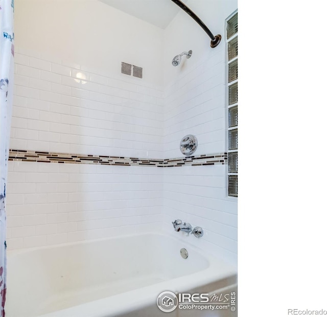 full bathroom featuring visible vents and shower / bath combination with curtain