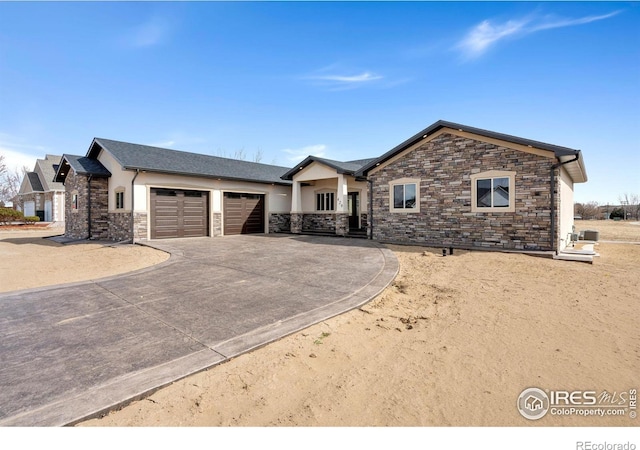 ranch-style house featuring stucco siding, driveway, and a garage