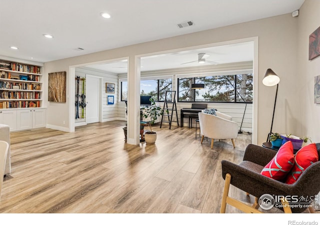 interior space featuring light wood finished floors, recessed lighting, visible vents, ceiling fan, and baseboards