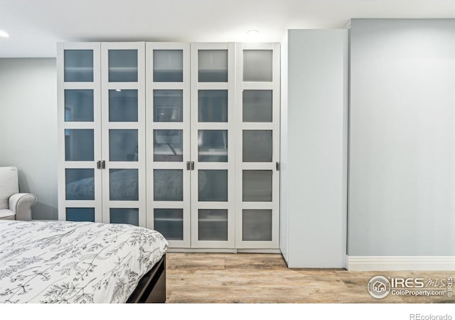 bedroom featuring recessed lighting and light wood-style floors