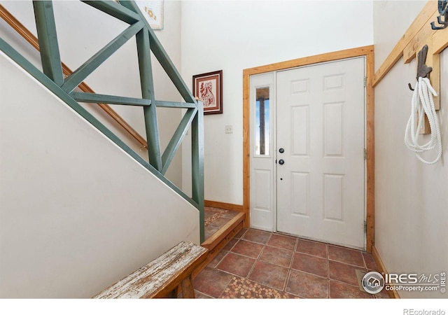 foyer entrance with baseboards