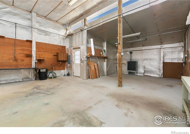 miscellaneous room with unfinished concrete floors