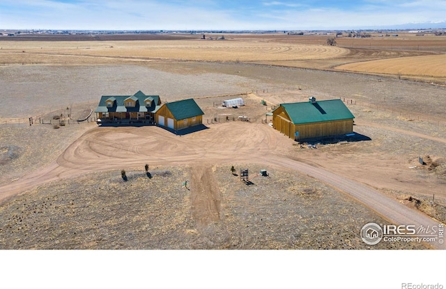 birds eye view of property featuring a rural view