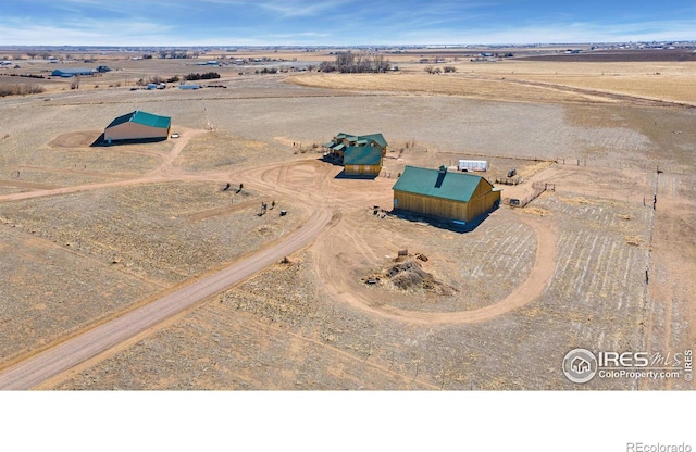 birds eye view of property featuring a rural view