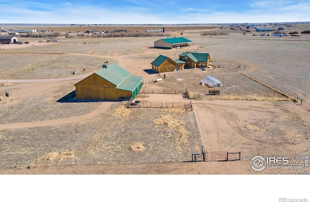 birds eye view of property featuring a rural view