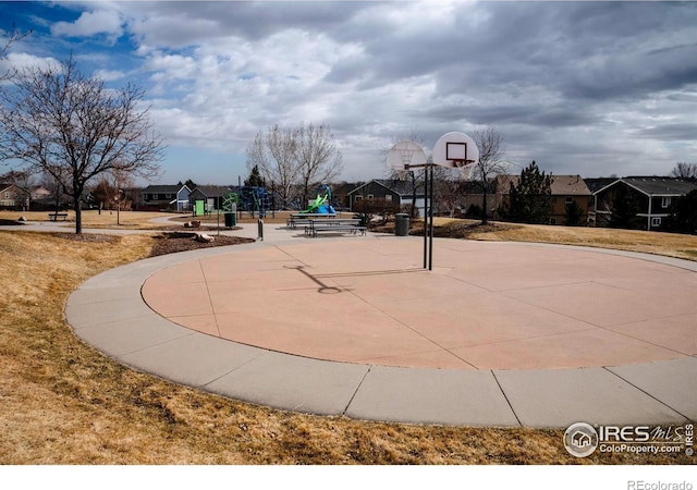 view of basketball court featuring a residential view and community basketball court