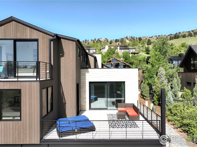 2586 3rd St, Boulder, CO 80304 - rear view of house featuring an outdoor hangout area and a balcony