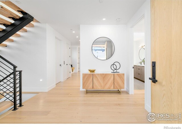 2586 3rd St, Boulder, CO 80304 - hall featuring wood finished floors, stairs, baseboards, and recessed lighting