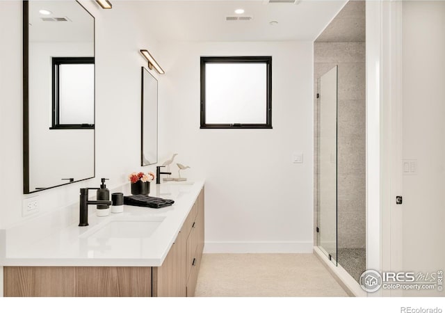 2586 3rd St, Boulder, CO 80304 - bathroom with a stall shower, double vanity, baseboards, and recessed lighting