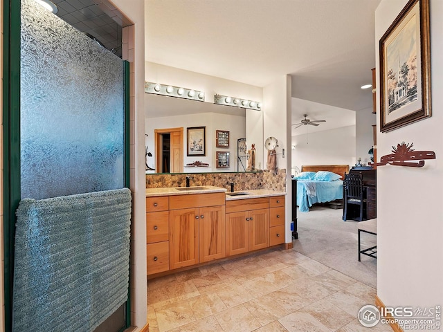 bathroom featuring walk in shower, ceiling fan, vanity, and ensuite bathroom