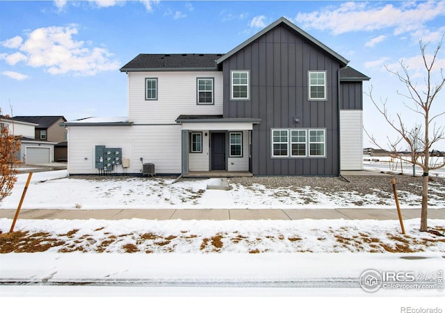 view of front of property featuring board and batten siding and central air condition unit