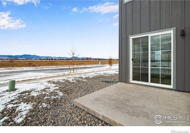 view of yard with a mountain view and a patio