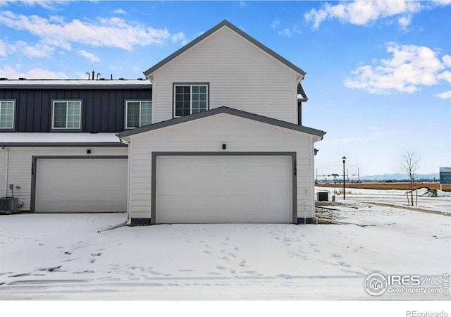 view of front of house featuring central air condition unit and board and batten siding