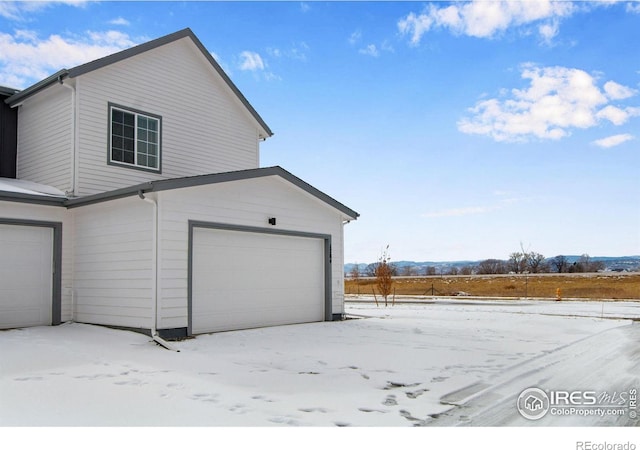 view of snow covered garage