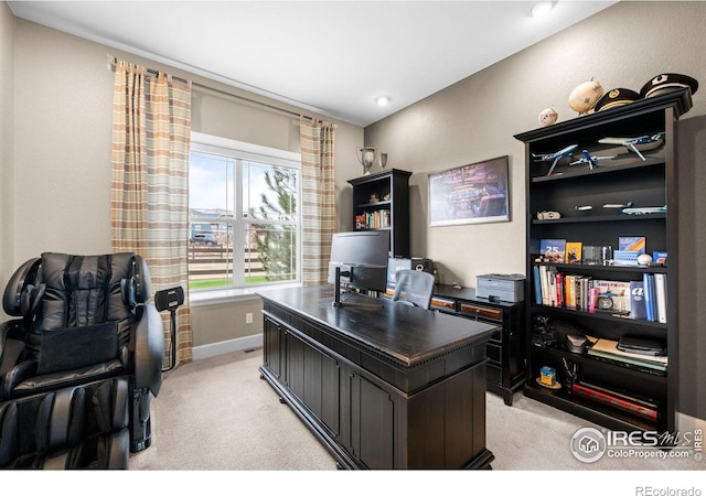 office featuring light carpet and baseboards