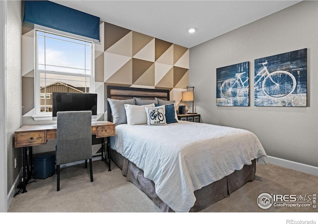 bedroom with carpet flooring and baseboards