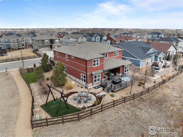 birds eye view of property with a residential view