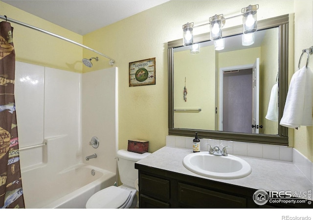 full bath featuring toilet, shower / washtub combination, and vanity