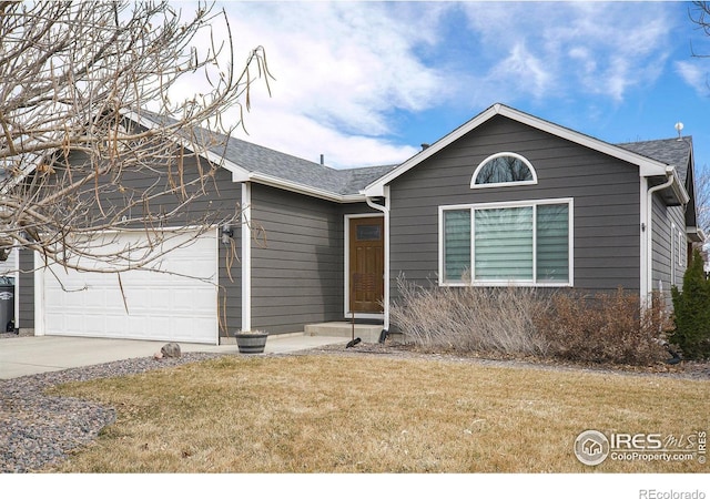 single story home with an attached garage, a shingled roof, a front lawn, and concrete driveway