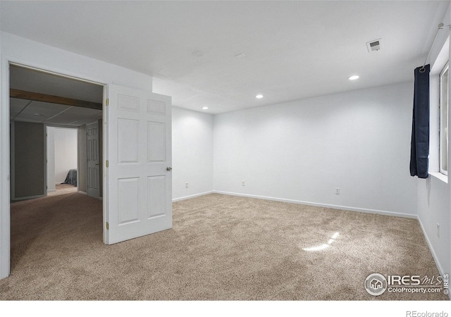 interior space featuring carpet, visible vents, baseboards, and recessed lighting