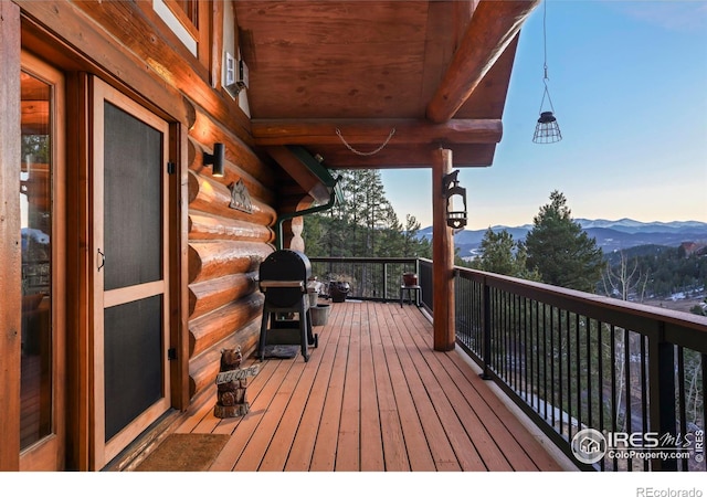 deck featuring a mountain view and area for grilling