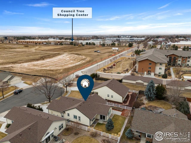 birds eye view of property with a residential view