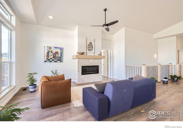 5626 Four Leaf Dr, Longmont, CO 80503 - living area featuring plenty of natural light, a ceiling fan, lofted ceiling, and wood finished floors