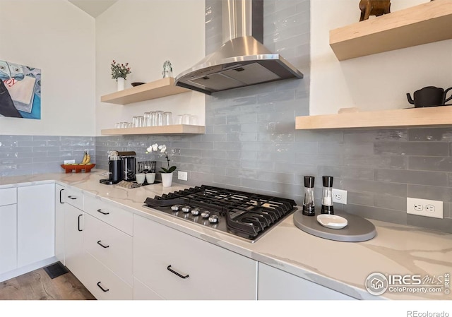 5626 Four Leaf Dr, Longmont, CO 80503 - kitchen featuring wall chimney range hood, open shelves, stainless steel gas stovetop, and decorative backsplash