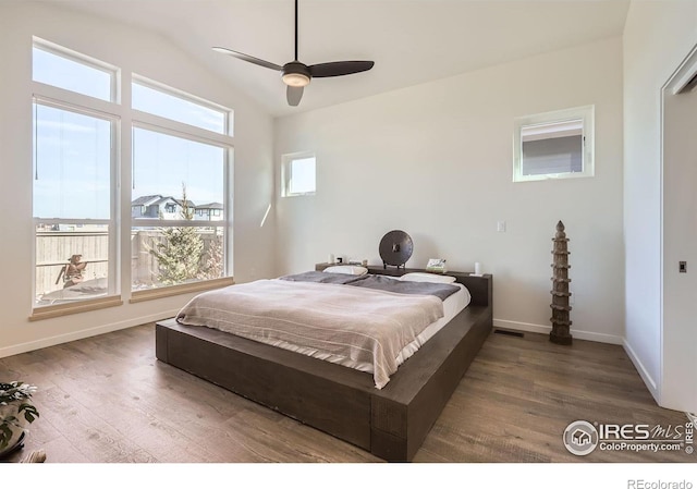 5626 Four Leaf Dr, Longmont, CO 80503 - bedroom with wood finished floors, baseboards, lofted ceiling, and ceiling fan
