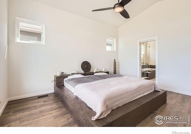5626 Four Leaf Dr, Longmont, CO 80503 - bedroom featuring wood finished floors, lofted ceiling, baseboards, a ceiling fan, and ensuite bath