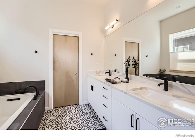 5626 Four Leaf Dr, Longmont, CO 80503 - bathroom featuring double vanity and a bath