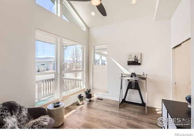 5626 Four Leaf Dr, Longmont, CO 80503 - exercise room featuring a ceiling fan, wood finished floors, vaulted ceiling, baseboards, and recessed lighting