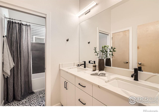 5626 Four Leaf Dr, Longmont, CO 80503 - bathroom featuring double vanity and shower / bath combo