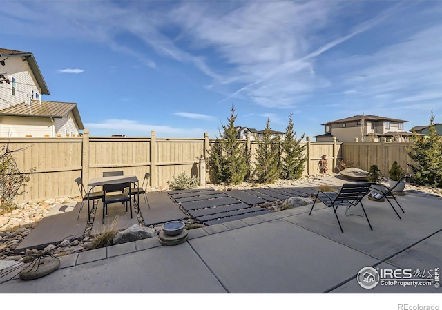 5626 Four Leaf Dr, Longmont, CO 80503 - fenced backyard with outdoor dining space and a patio