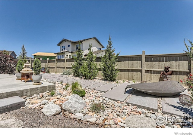 5626 Four Leaf Dr, Longmont, CO 80503 - fenced backyard featuring a patio